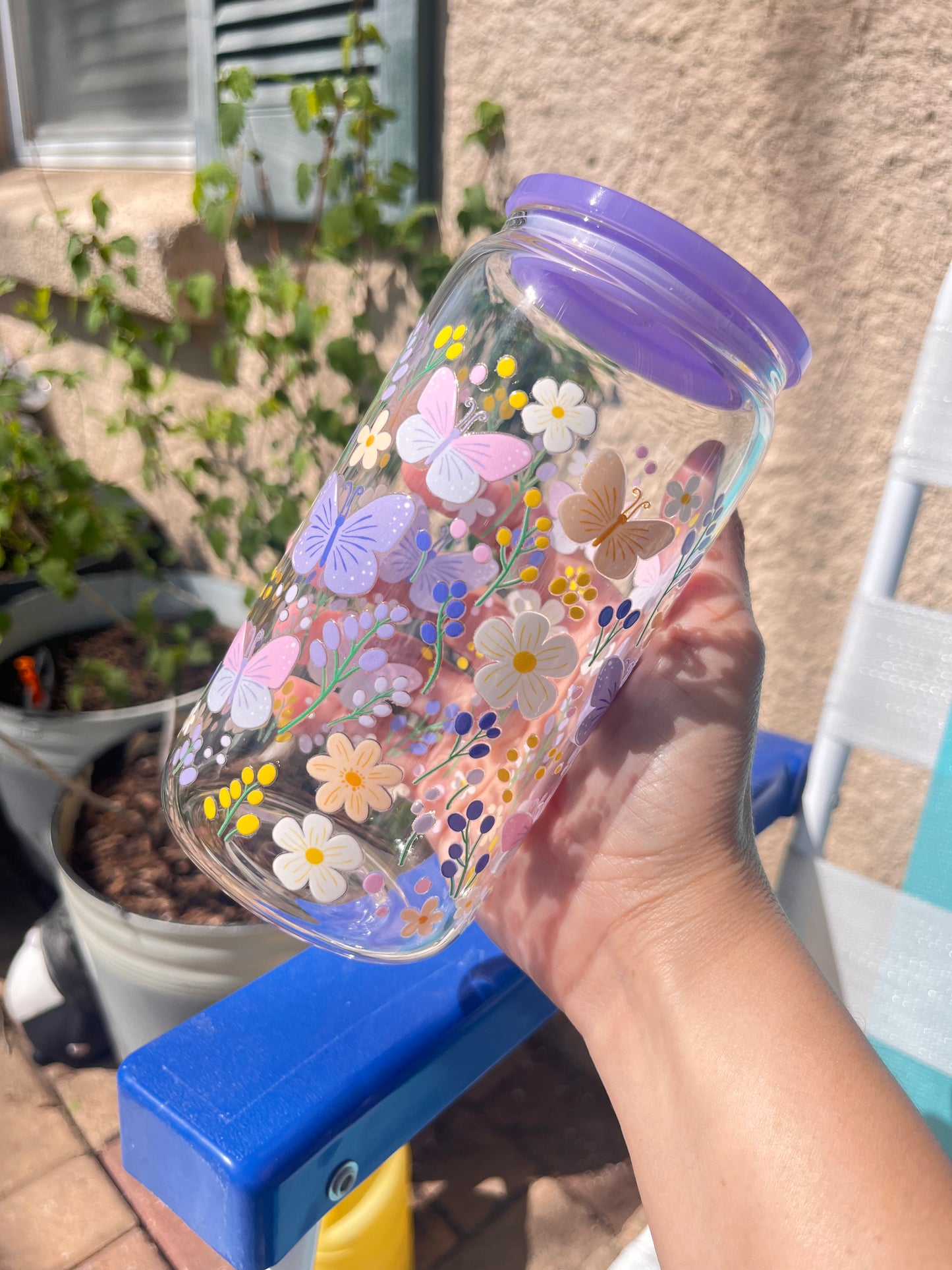 Violet butterflies and wild flowers glass cup