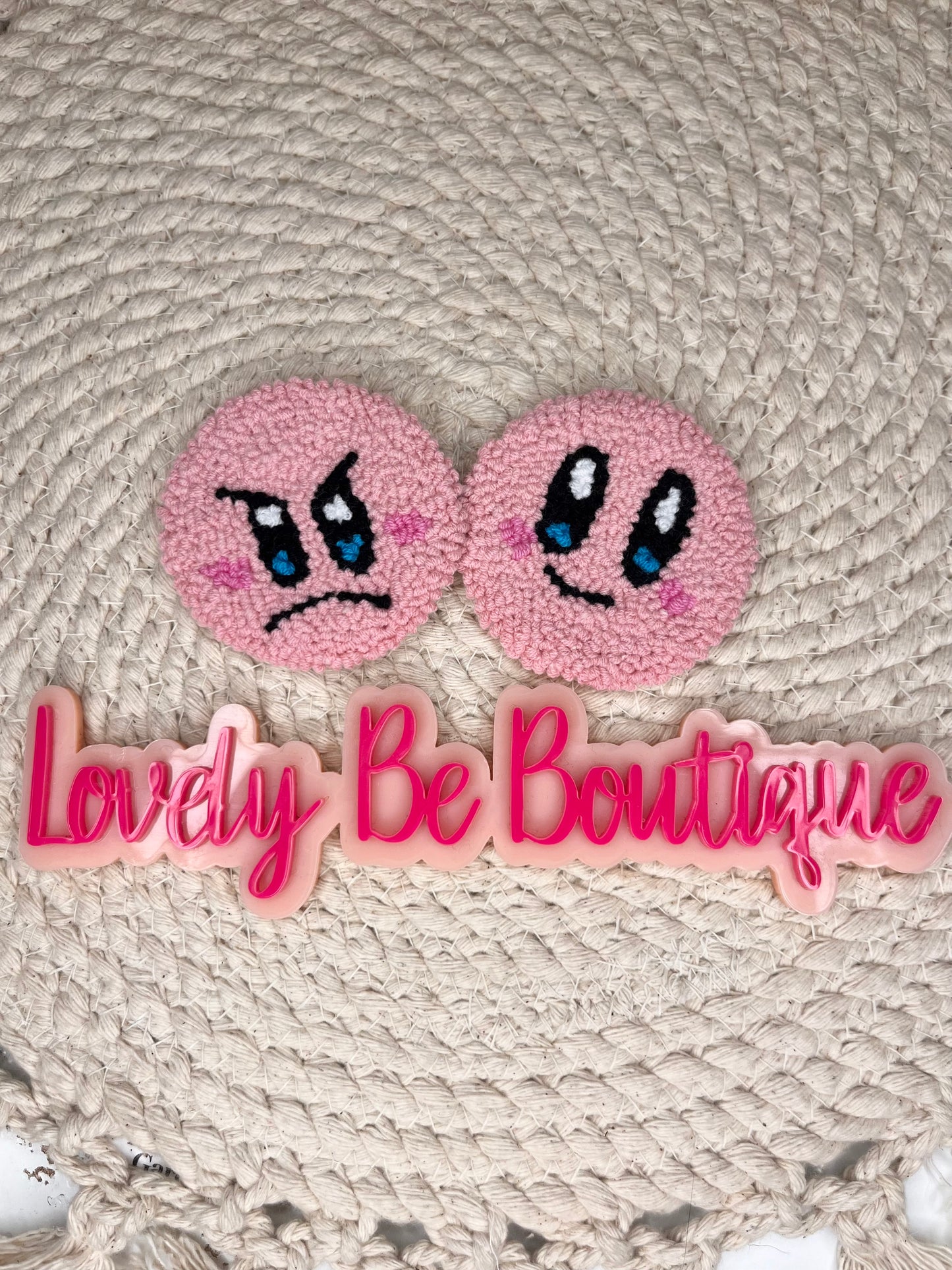 Pink happy/mad face car coasters