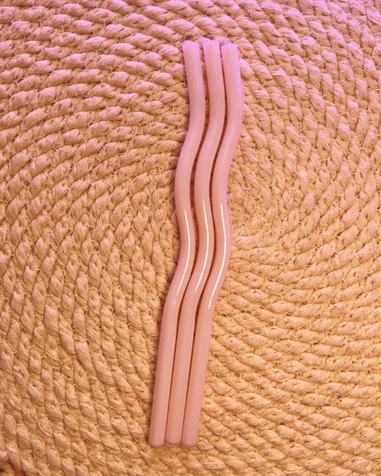 Light colored assorted wavy glass straws