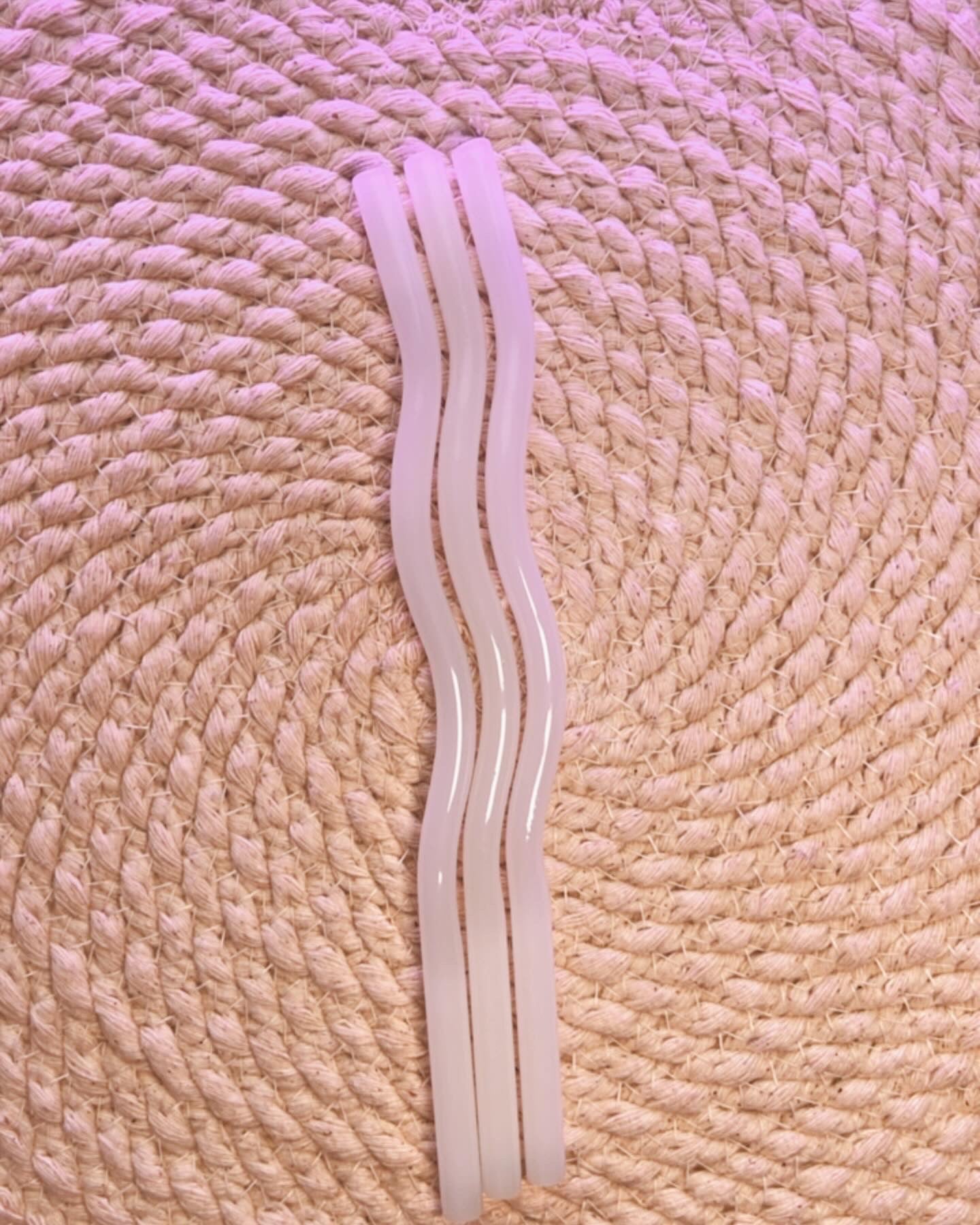 Light colored assorted wavy glass straws