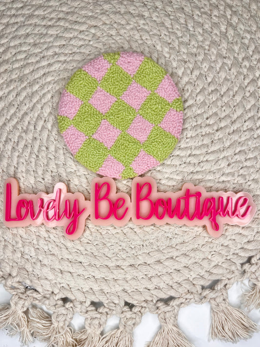 Pink and green checkered mug rug