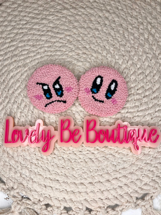 Pink happy/mad face car coasters